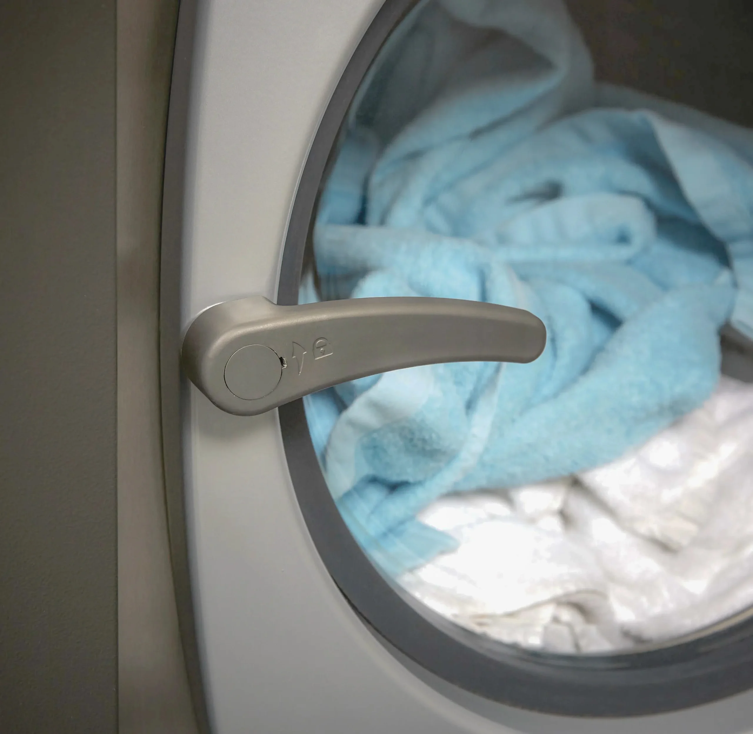 Close-up of towels inside a Girbau commercial washer, representing hotel laundry processes for spas, guest rooms and leisure facilities.