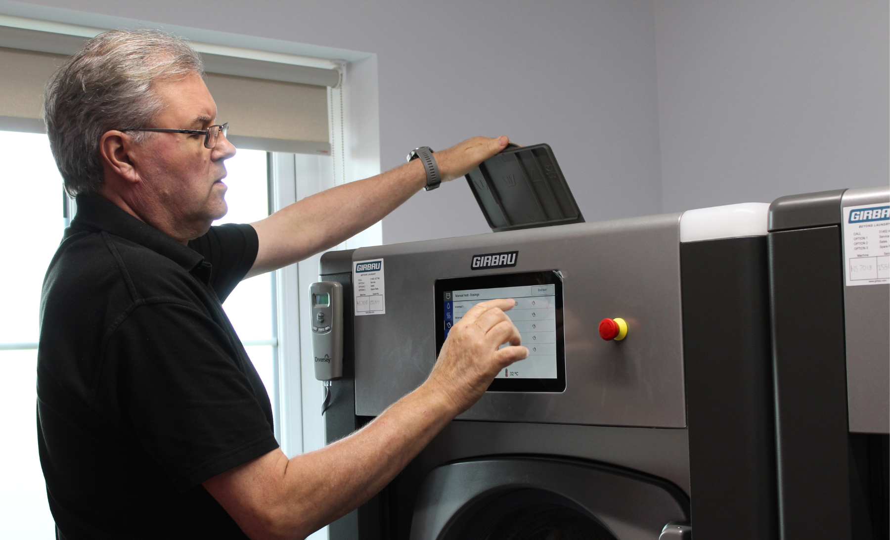Field Service Engineer Carrying out Maintenance on Washing Machine