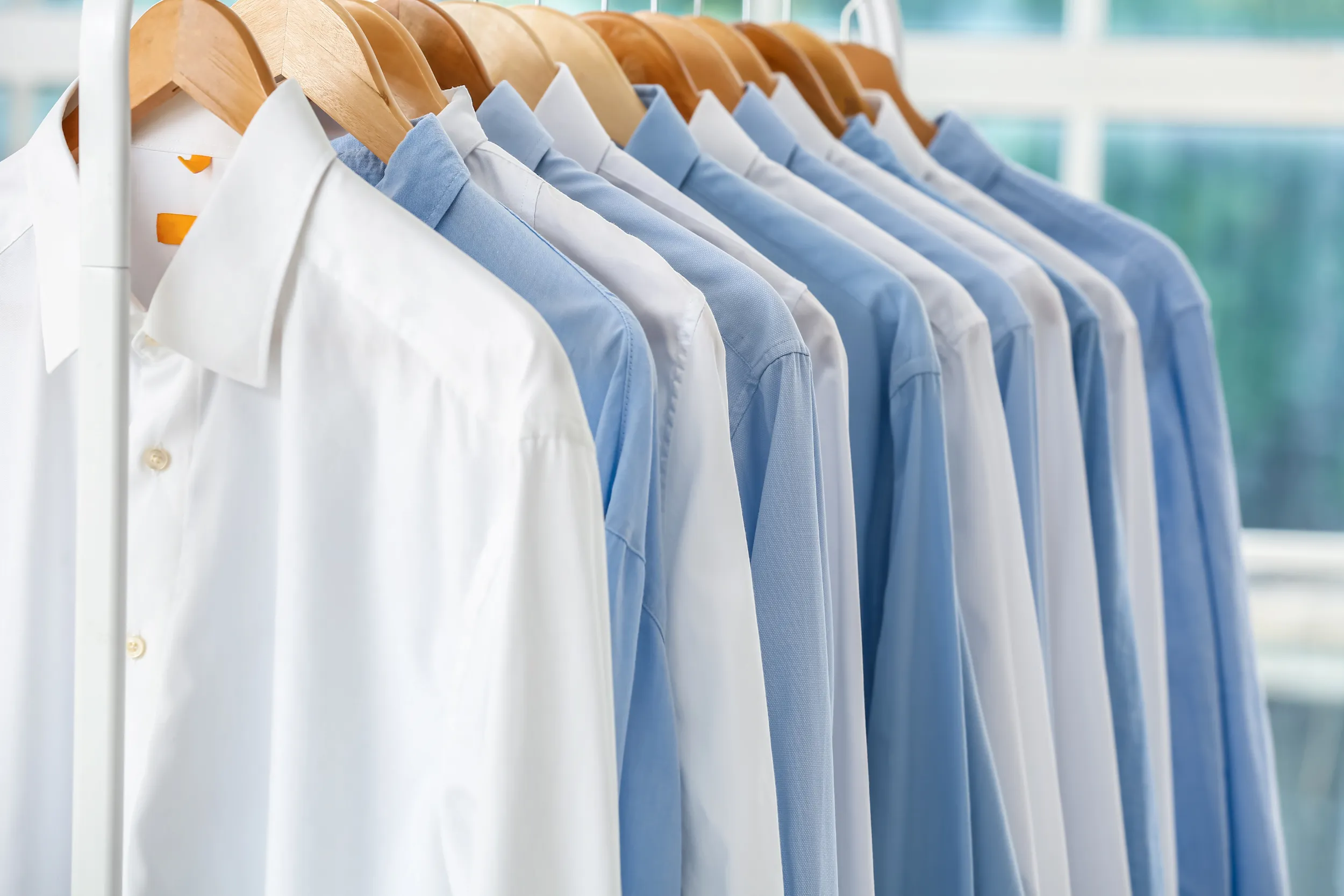fresh-clean-shirts-on-hangers-in-dry-cleaning-room
