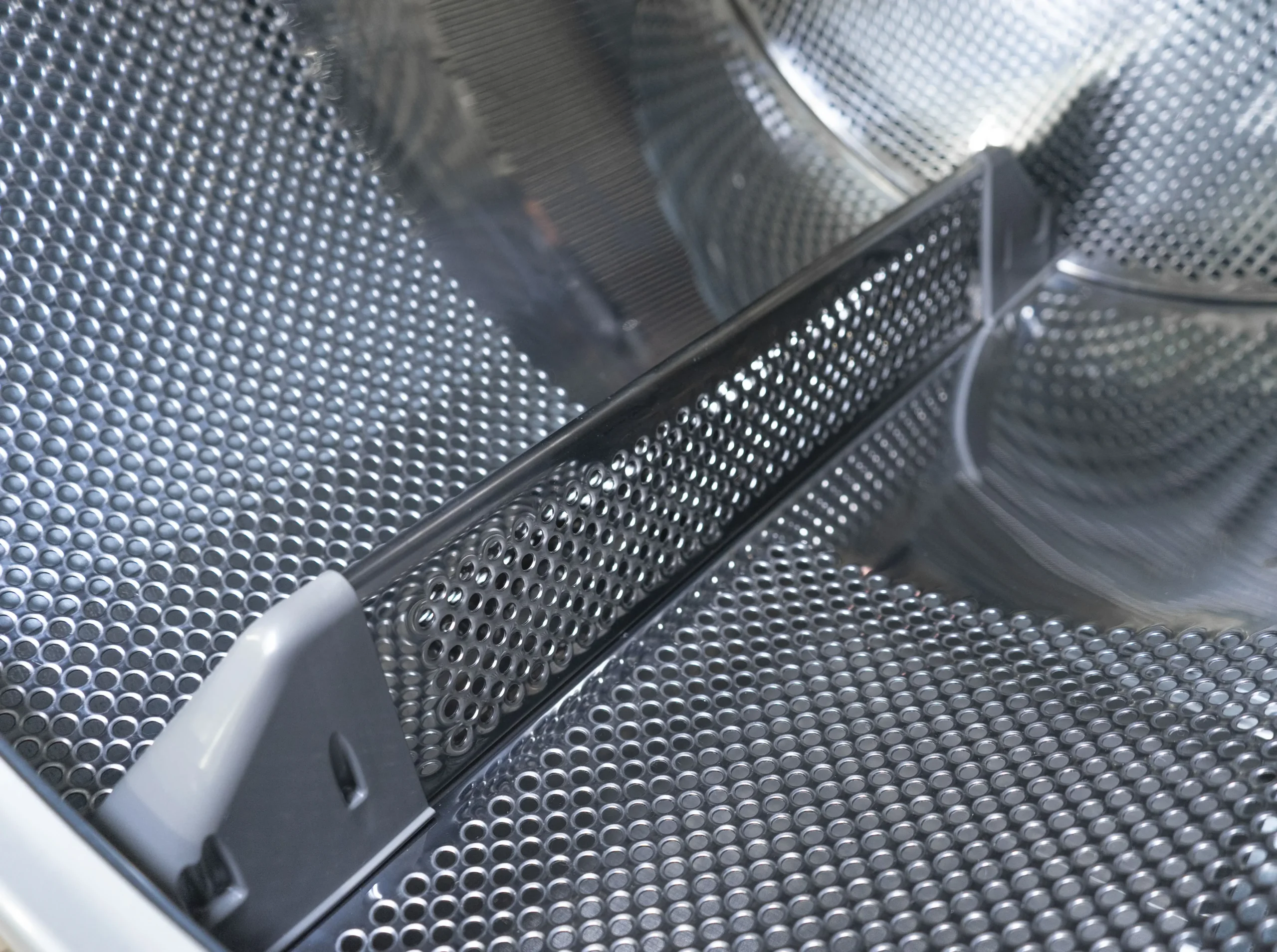 Stamped drum holes instead of drilled, allowing for a longer lifespan of the linen.