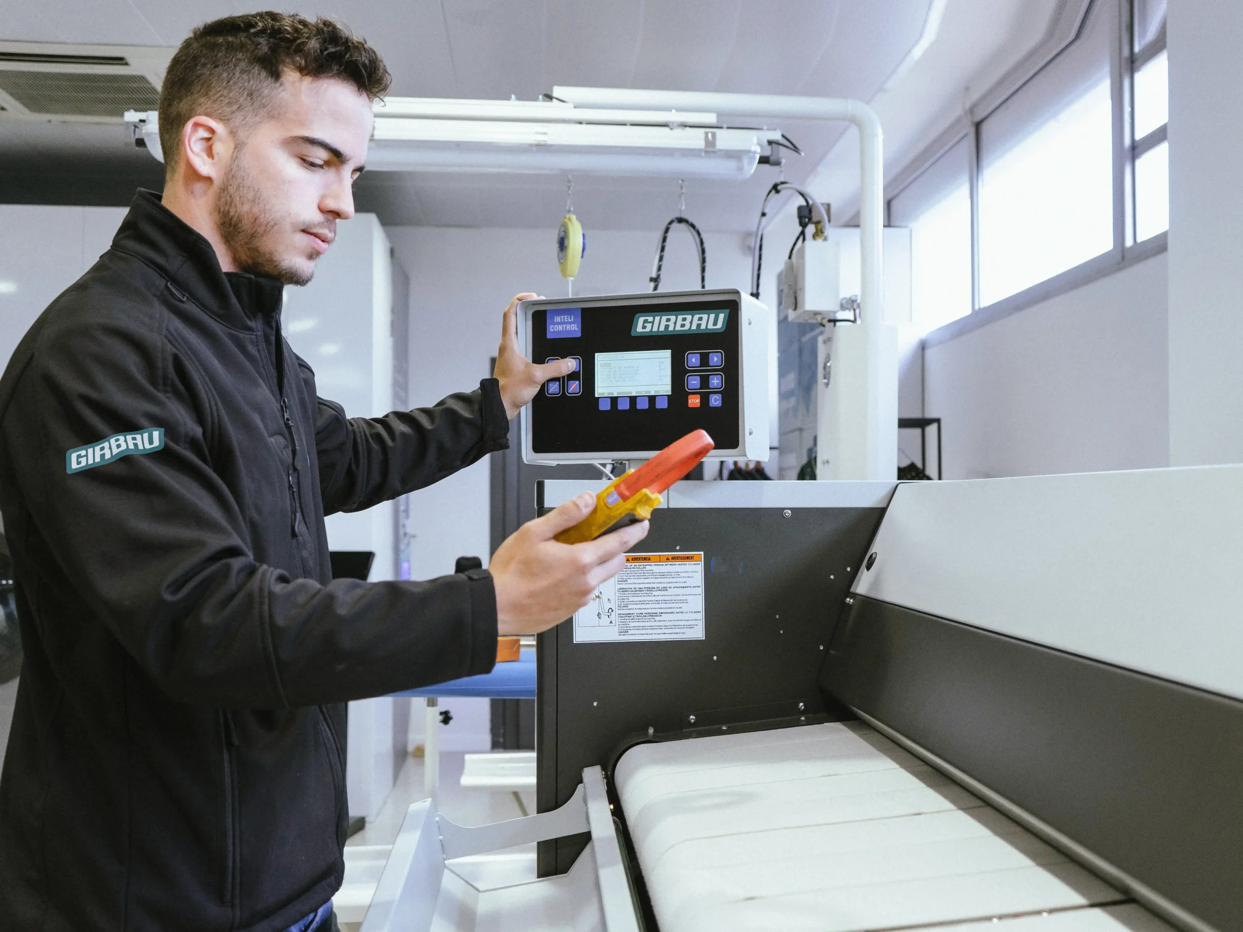 Specialized technical service performing checks to ensure the proper functioning of Girbau equipment.