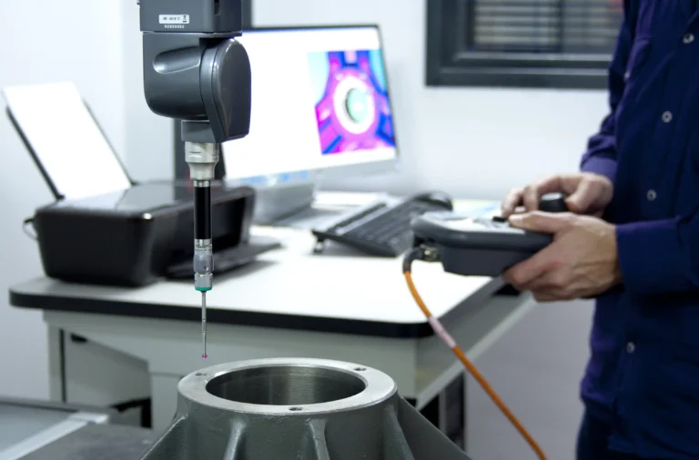 Technician performing a precision maintenance check on industrial laundry components using advanced diagnostic equipment.