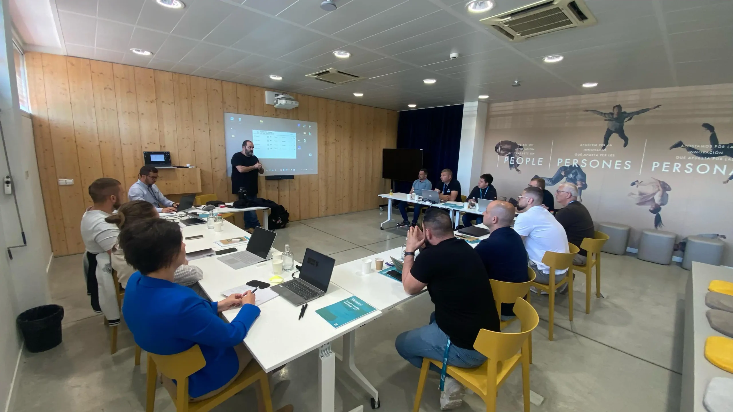 Group attending a Girbau technical training session to improve professional laundry operations, equipment use, and maintenance practices.
