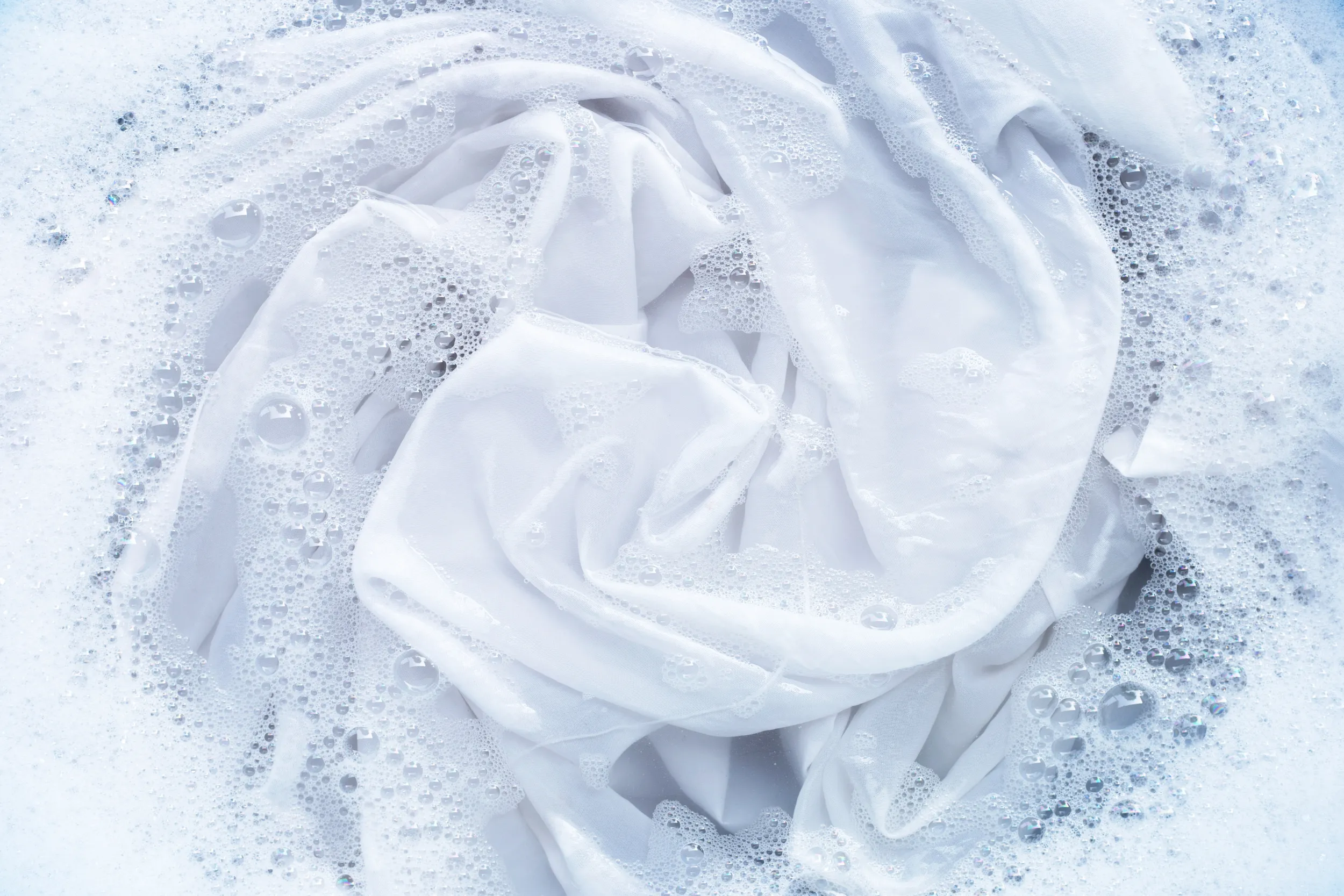 White sheets with laundry detergent