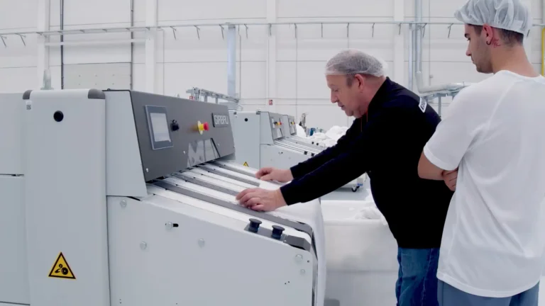 Girbau specialists performing an industrial laundry audit and consulting process to optimize equipment efficiency.