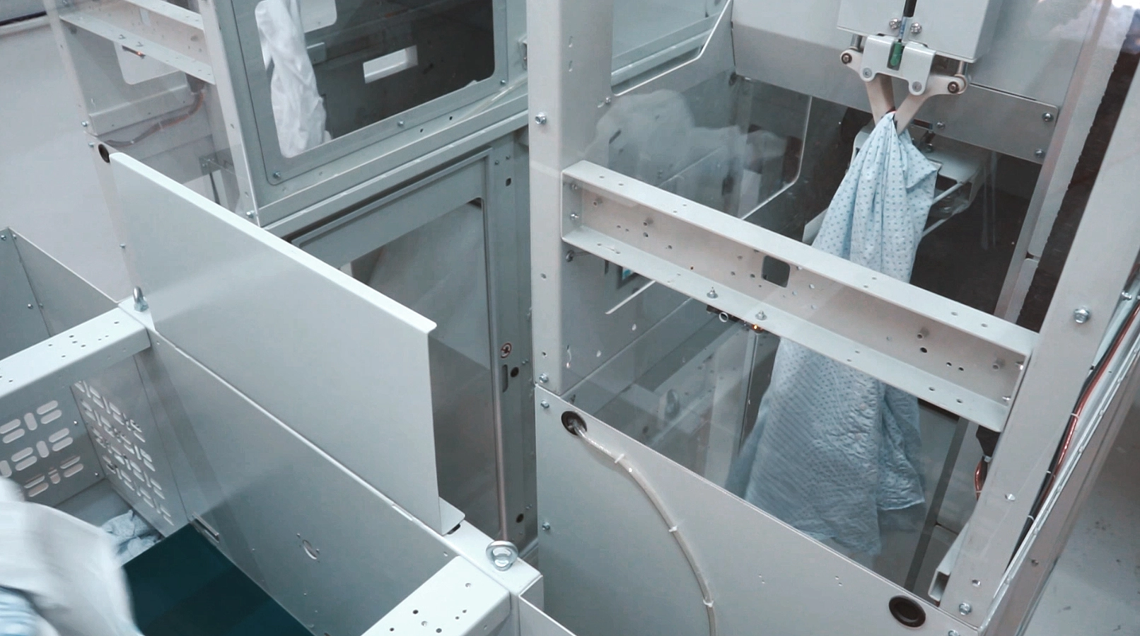 Industrial garment classification system using clamps.