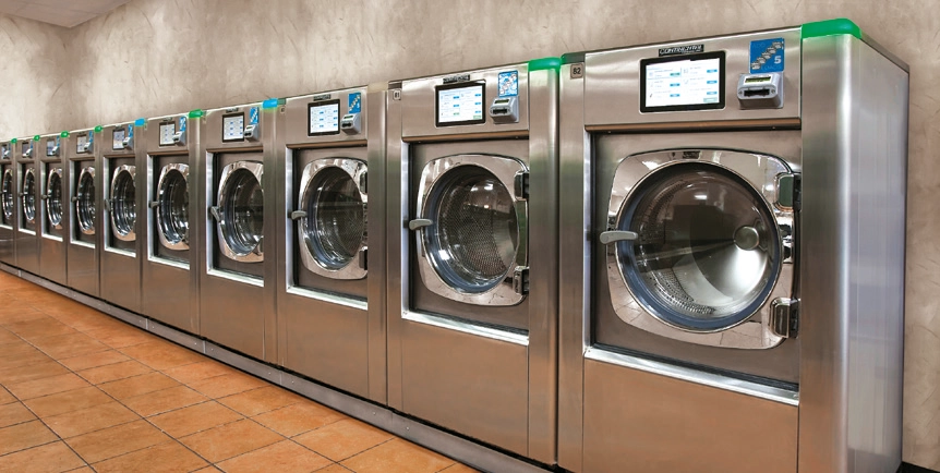 Girbau industrial washing machines installed in the Jaeger self-service laundry.