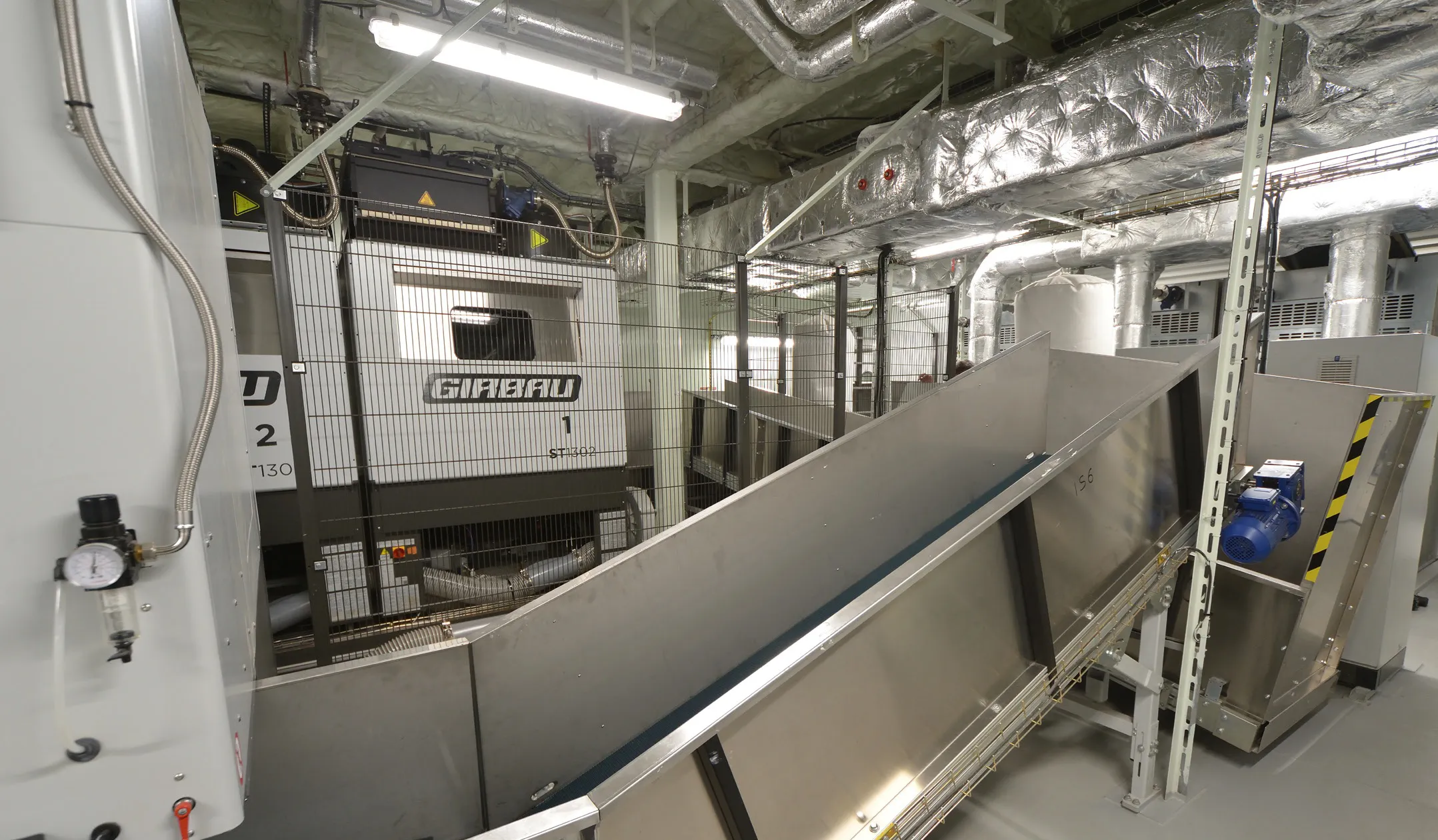 Girbau industrial drying system with automatic loading conveyor onboard MSC World Europa.