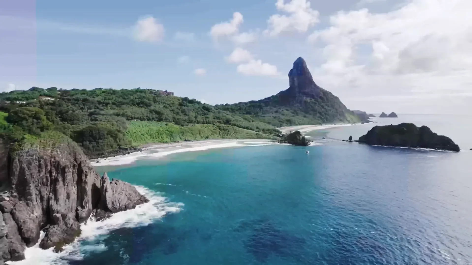 Aerial view of Fernando de Noronha island and its tropical coastline.
