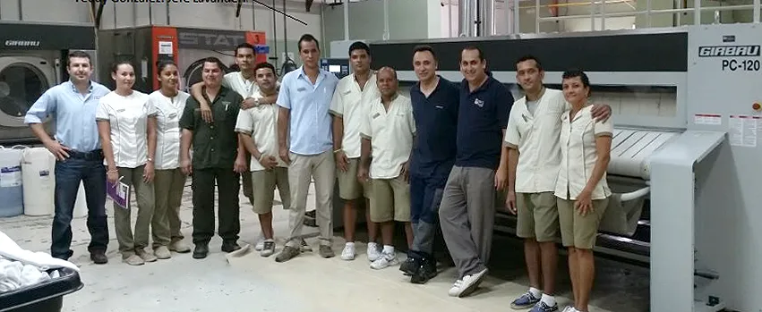 Girbau and resort laundry team with manager Yeudy Gómez at The Westin Playa Conchal.