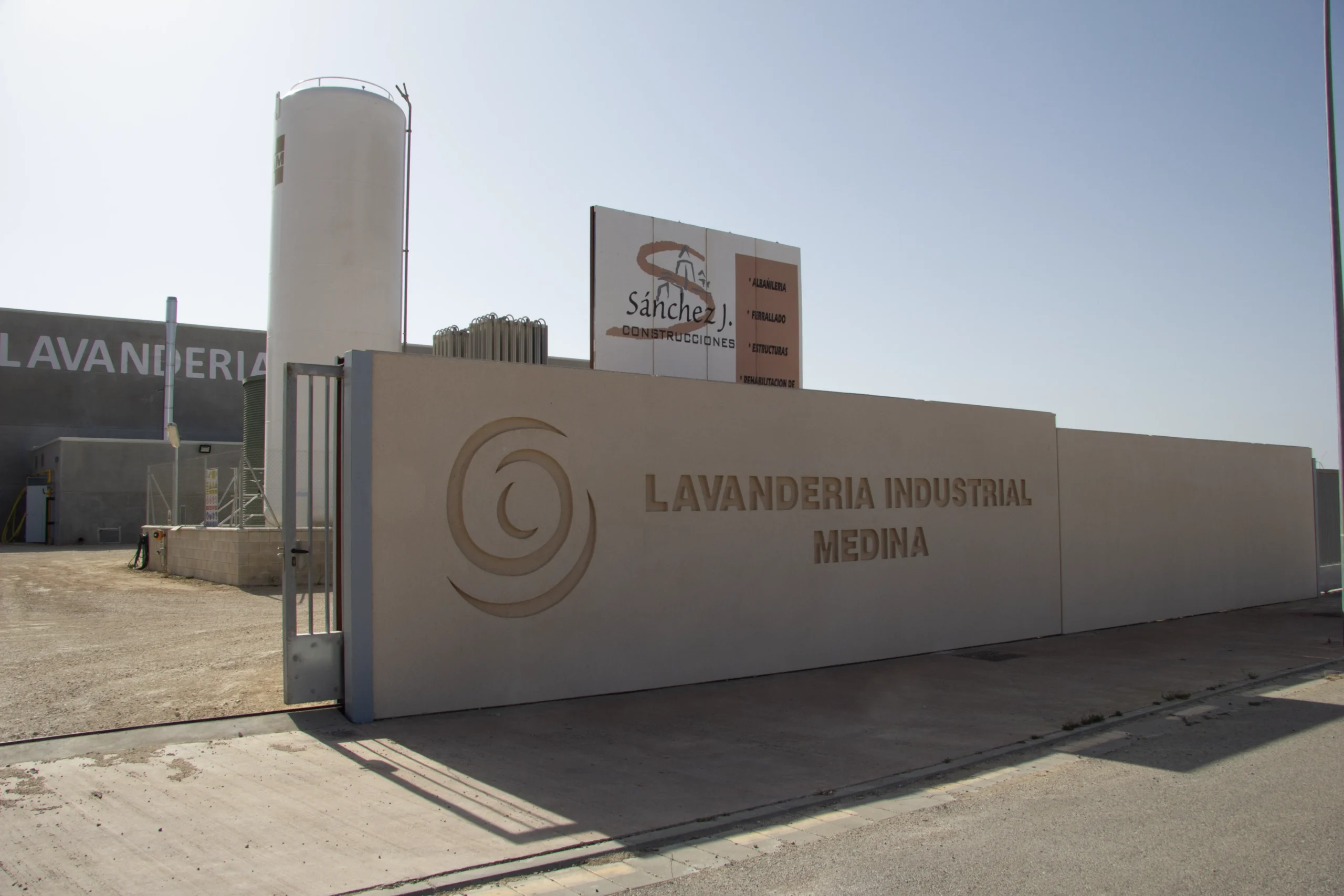 Entrance and exterior facade of industrial laundry Medina.