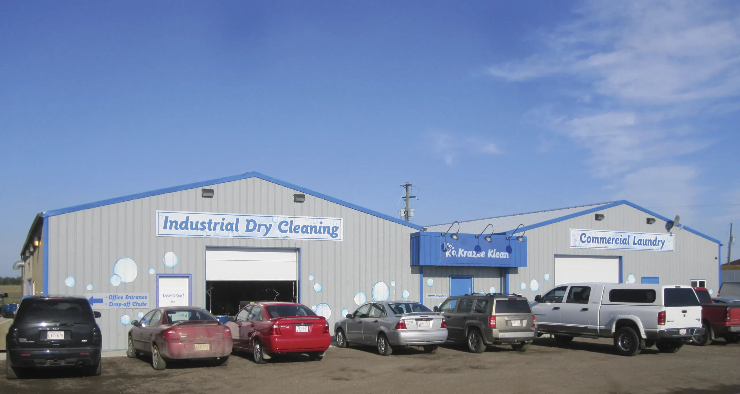 Exterior view of the Krazee Klean facility featuring the commercial laundry and industrial dry cleaning areas in Alberta.